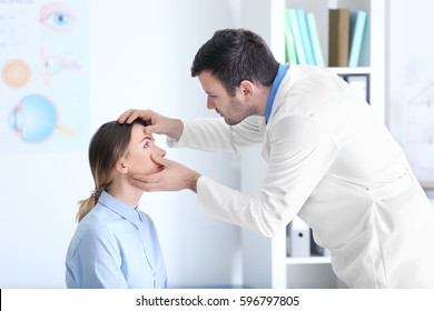 Adult Male Doctor Examining Patient