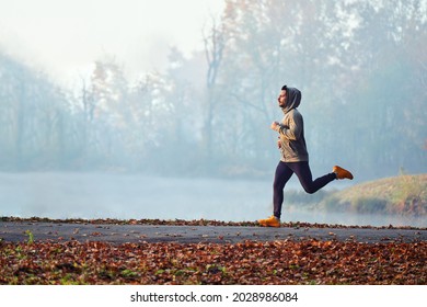 Adult male running in park at autumn morning - Powered by Shutterstock