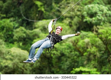 Adult Male Tourist Wearing Casual Clothing On Zip Line Or Canopy Experience In Ecuadorian Rain Forest - Shutterstock ID 333445322