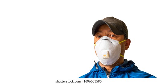 An Adult Male Worker Is Wearing An N95 Respirator Mask And Looking Into The Camera Lens. White Background For Copy Space.