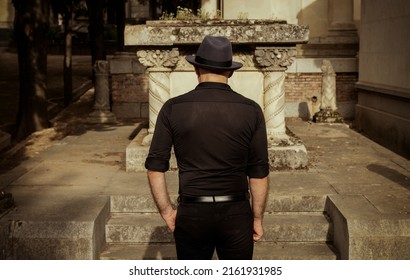 Adult Man In Black Mourning In Cemetery