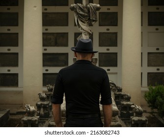 Adult Man In Black Mourning In Cemetery