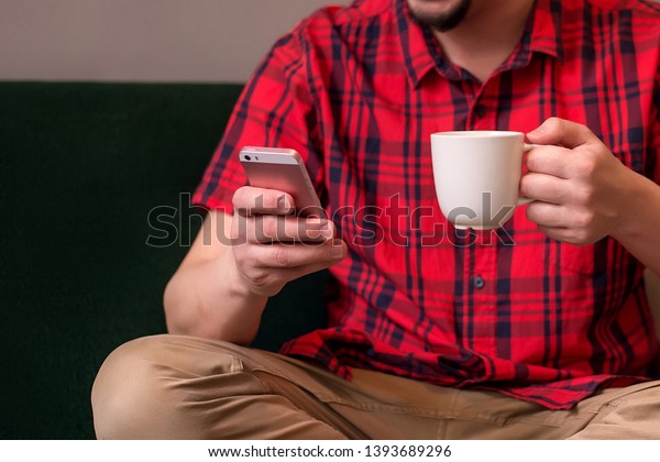 red shirt and brown pants