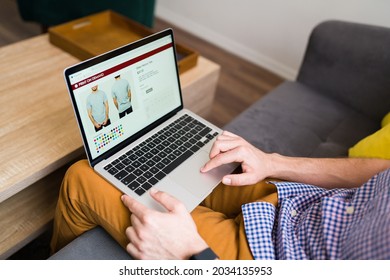 Adult Man Doing Online Shopping During A Leisure Day At Home. Young Man Buying Clothes Online