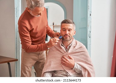 Adult Man Getting Haircut At Home During Quarantin