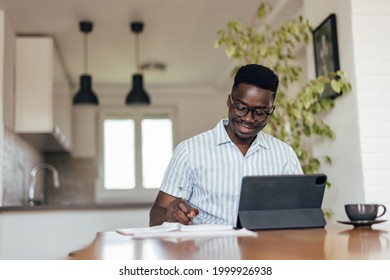 Adult man, giving advice to his coworkers, while working from home. - Shutterstock ID 1999926938