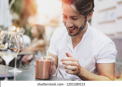 Adult Man Having Fun In A Bar Outdoor Drinking On A Moscow Mule 