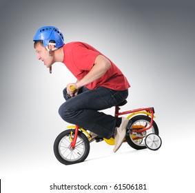 adult on kids bike