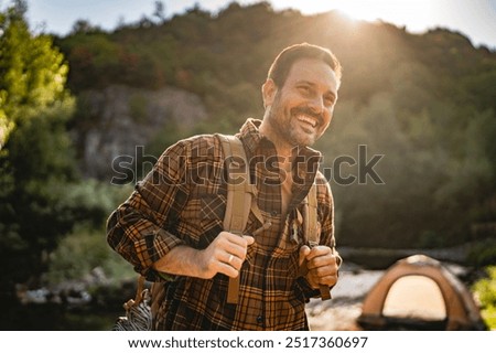 Similar – Foto Bild Mann beim Wandern mit leichtem Rucksack