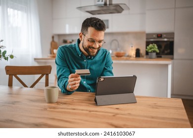 adult man at home shopping online use internet hold credit card e-banking online shop e-commerce - Powered by Shutterstock