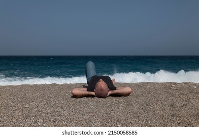 Adult Man Lying Down On Beach