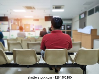 adult man and many people waiting medical and health services to the hospital,patients waiting treatment at the hospital,blurred image of people - Powered by Shutterstock