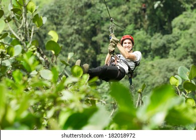 Adult Man On Zip Line Andes Rain Forest In Ecuador