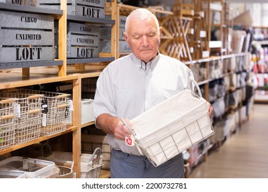 Adult Man Pensioner Choosing Storage Basket At Store Of Household Goods