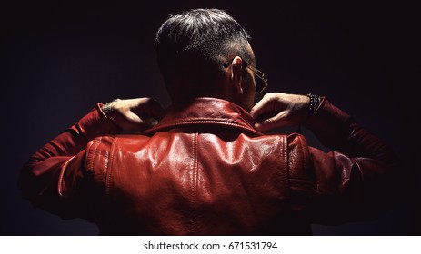 Adult Man In Red Leather Jacket, View From Back. 