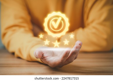 Adult man shows the sign of the top service the best quality assurance with golden five stars. Quality assurance of business services, Guarantee, Standards, ISO certification and testimonial concept. - Shutterstock ID 2247817315