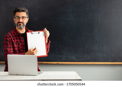 Adult Man Teacher Showing Empty Paper.