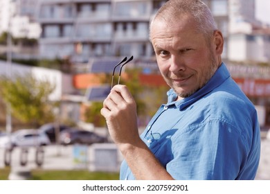 Adult Man Walking In The City On A Sunny Summer Day