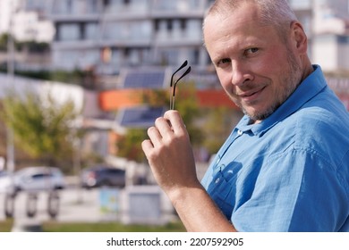 Adult Man Walking In The City On A Sunny Summer Day