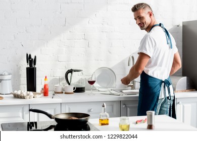 Man Washing Dishes Images Stock Photos Vectors Shutterstock