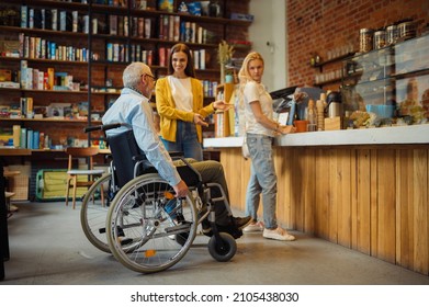 Adult Man In Wheelchair In A Queue At A Cafe