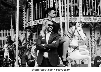 Adult Man And Woman On Merry Go Round Carousel