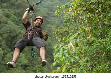 Adult Man Zip Line Adventure In Ecuadorian Rainforest