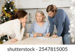 Adult married couple helps elderly woman make will testament, declaration for loan, application for settlement in nursing home during winter holiday