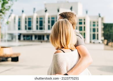 An Adult Mature Happy Romantic Couple In Love Outdoors In City Street Park. A Blonde Caucasian Man And Woman Spend Time Together. Senior Wife And Husband Walking Outside On Square