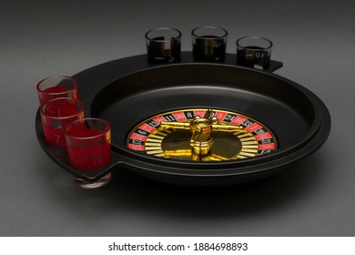 Adult Party Game Drinking Roulette. Drinking Roulette On A Gray Background.