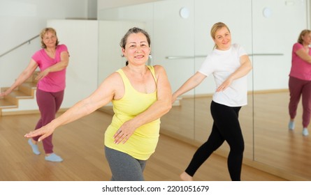 Adult People Learning Swing Steps At Dance Class And Smiling