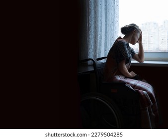 Adult poor tired sore ill injure wheel chair invalid lady seat indoor dark old cold home room look light white war city sky text space. Fail sit teen human beg hand ask god Jesus Christ wait love hope - Powered by Shutterstock