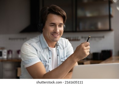 Adult Remote Student In Headphones Attending Virtual Lesson, Watching Learning Webinar On Laptop, Enjoying Distance Education, Remote Learning Process. Online Support Manager Talking To Customer