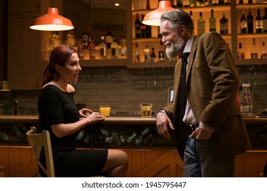 An Adult Respectable Man Meets A Young Woman In A Bar And Takes Her Phone Number. Woman Writing Phone Number On A Napkin