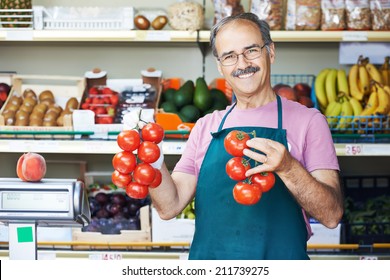 adult senior sale man with tomato at vegetable market shopping store - Powered by Shutterstock