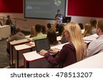 Adult student using laptop computer at a university lecture