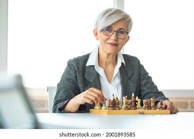 Adult Stylish Woman Playing Chess