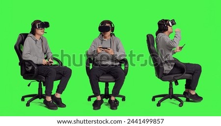 Adult uses vr gadgets for gameplay with smartphone app, sitting on gaming chair in isolated full body greenscreen. Asian male model playing multiplayer contest of virtual reality games.