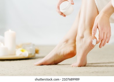 Adult Woman with beautiful feet and cream closeup. Spa treatment. Skincare cosmetic and healthy concept. - Shutterstock ID 2107689989