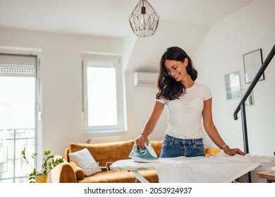 Adult woman, doing her chores, after work, at her home. - Powered by Shutterstock