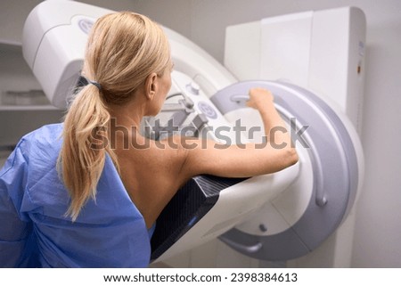 Adult woman is getting digital breast tomosynthesis in clinic