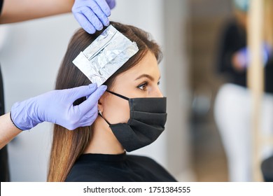 Adult Woman At Hairdresser Wearing Protective Mask Due To Coronavirus Pandemic