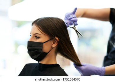 Adult Woman At Hairdresser Wearing Protective Mask Due To Coronavirus Pandemic