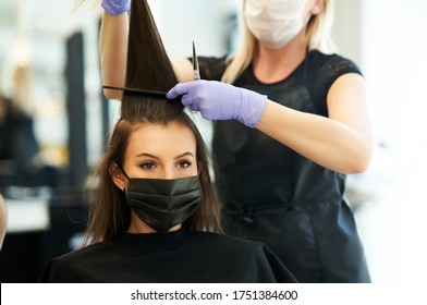 Adult Woman At Hairdresser Wearing Protective Mask Due To Coronavirus Pandemic