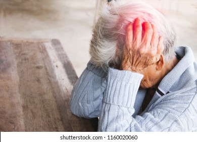 Adult Woman Has A Headache. She Sitting Head In Hands On Dark Black Room. Concept Dramatic Loneliness, Sadness, Depression, Sad Emotions, Cry, Disappointed,healthcare, Pain.