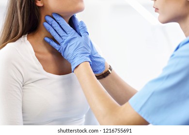 Adult woman having a visit at female doctor's office - Shutterstock ID 1216755691