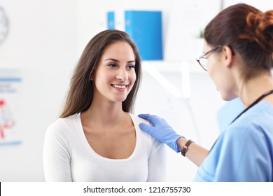 Adult Woman Having A Visit At Female Doctor's Office