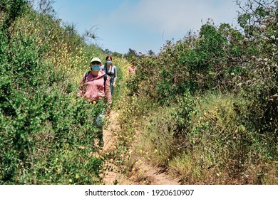 Adult Woman And Her Family Hiking With Protective Mask On, Vacation Concept In Covid19 Time