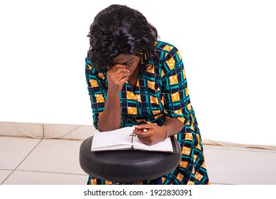 Adult Woman Kneeling Praying With Rosary And Holy Bible In Church.