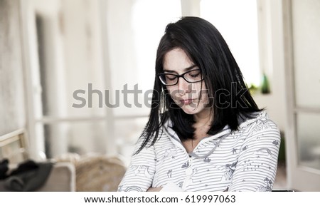 An adult woman making a gooy pouting face while waking up.